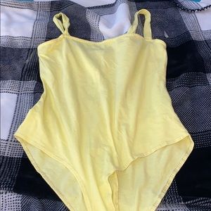 yellow body suit